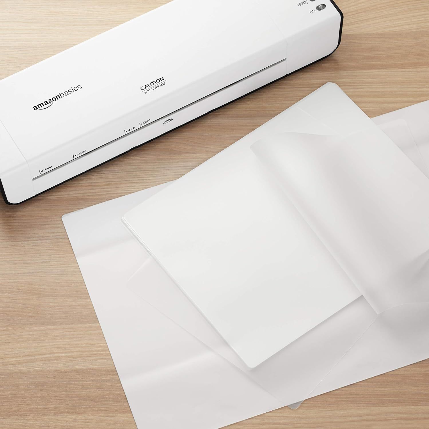 Shows the laminator in a real-world office or home setting with laminated sheets to help shoppers visualize the product in use and understand its practical…