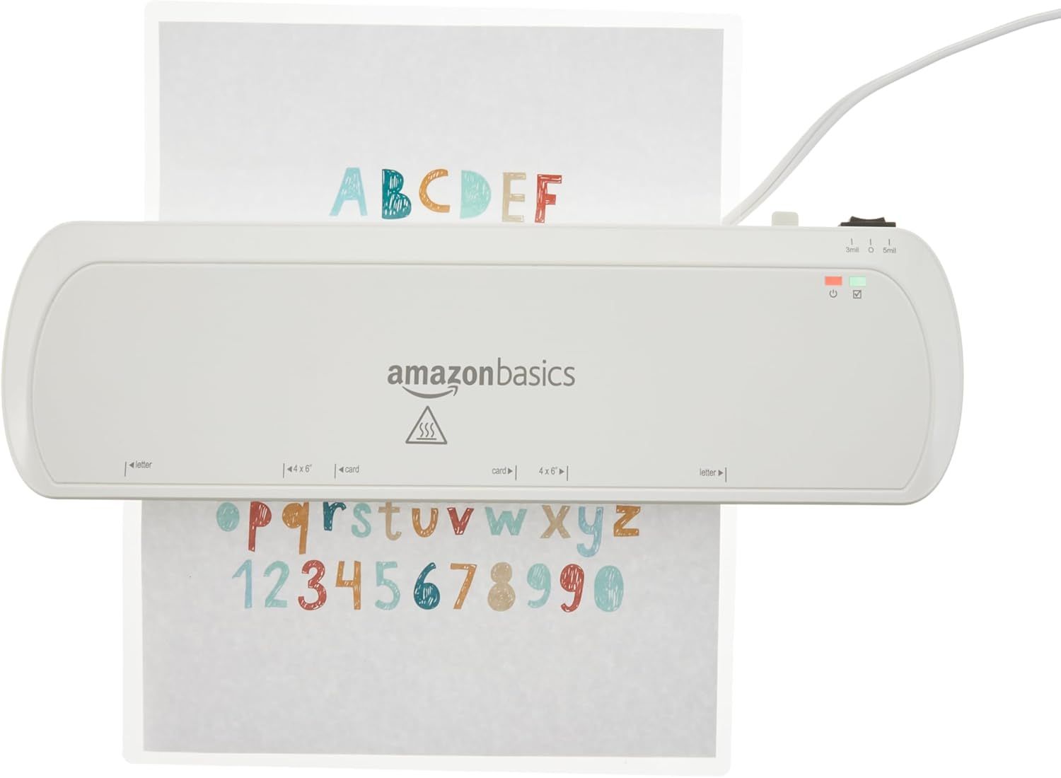 Shows the AmazonBasics laminator in use with a colorful alphabet and numbers sheet being laminated, demonstrating the product in action on a clean white…