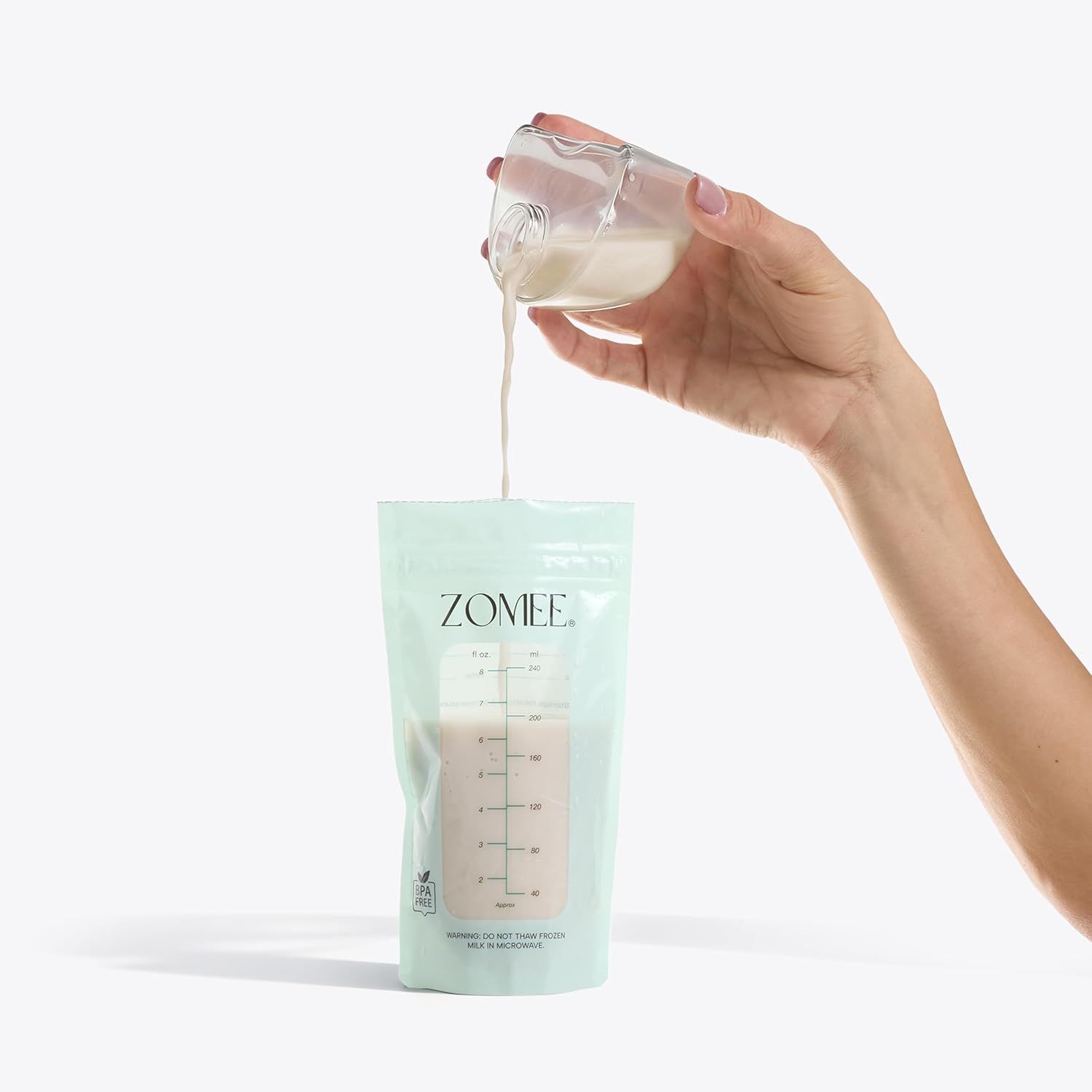 Demonstrates how to use the product by showing milk being poured from a glass into the ZOMEE storage bag, communicating ease of use and practical application. Highlights the simple, convenient…
