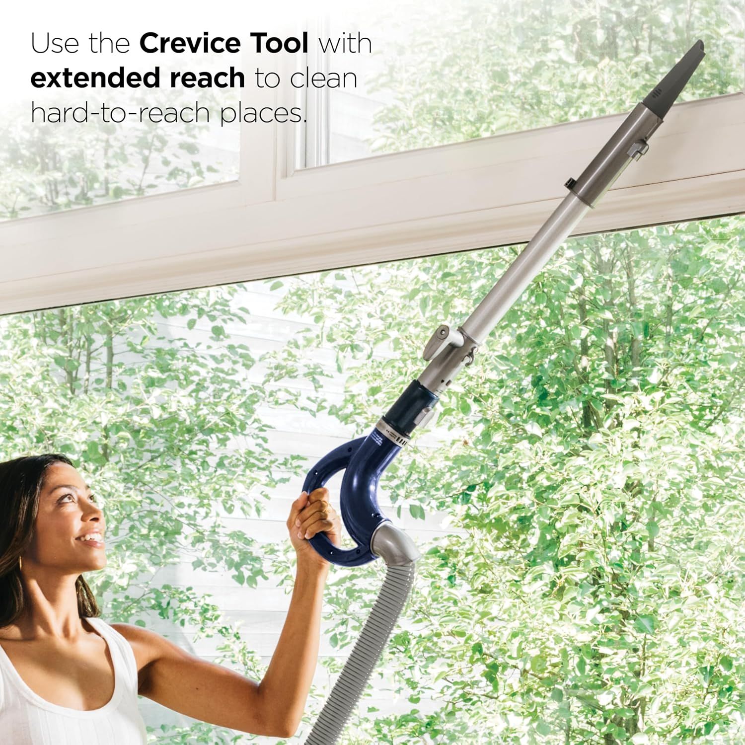 Demonstrates how to use the crevice tool attachment with extended reach to clean hard-to-reach places like ceiling corners and high surfaces. Highlights the…