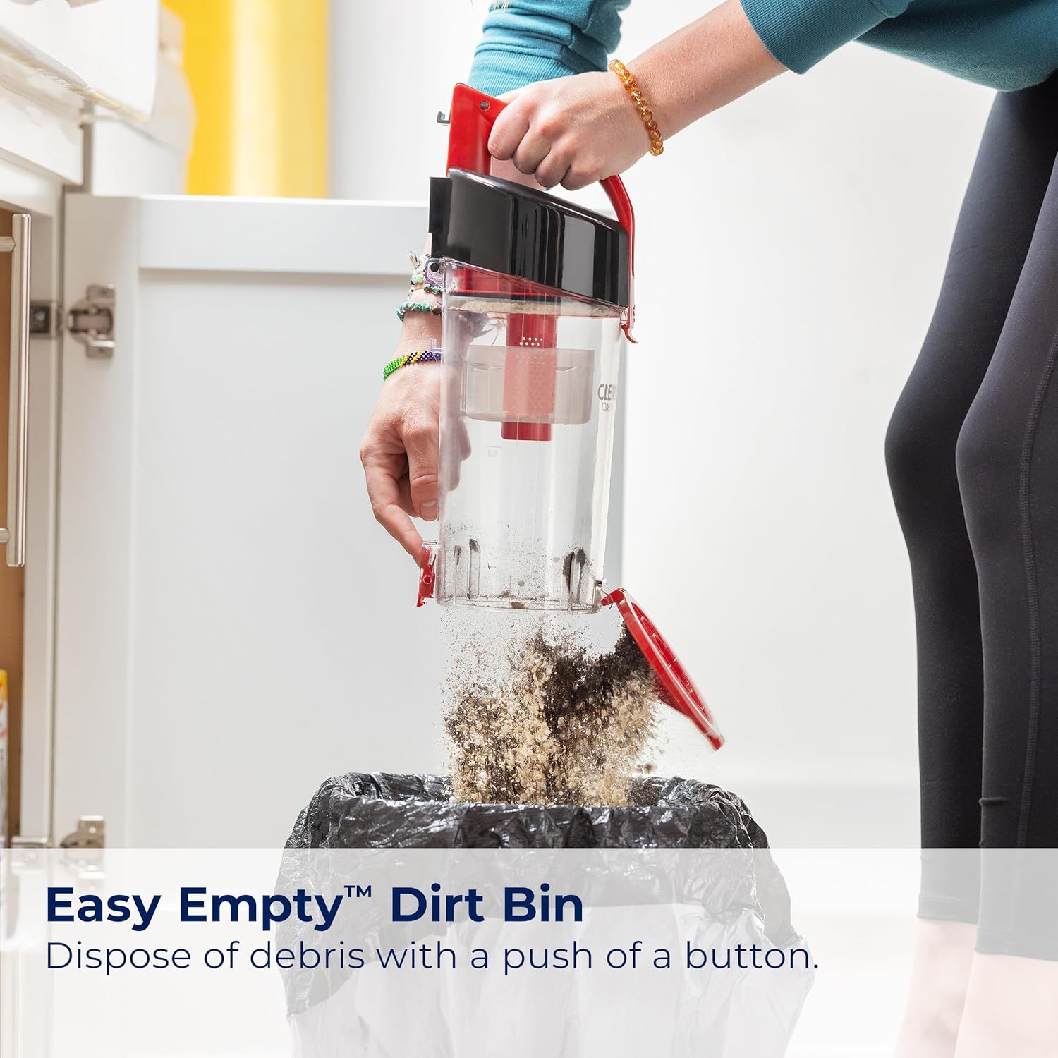 Demonstrates how simple it is to empty the vacuum's dirt bin with a push-button mechanism, reassuring shoppers that maintenance is quick and mess-free.…