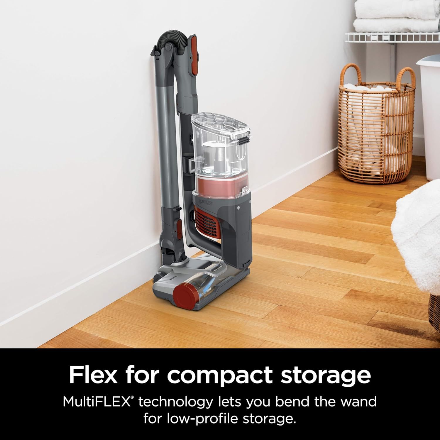 Demonstrates the vacuum's MultiFLEX technology that allows the wand to bend for low-profile, space-saving storage in tight spaces.