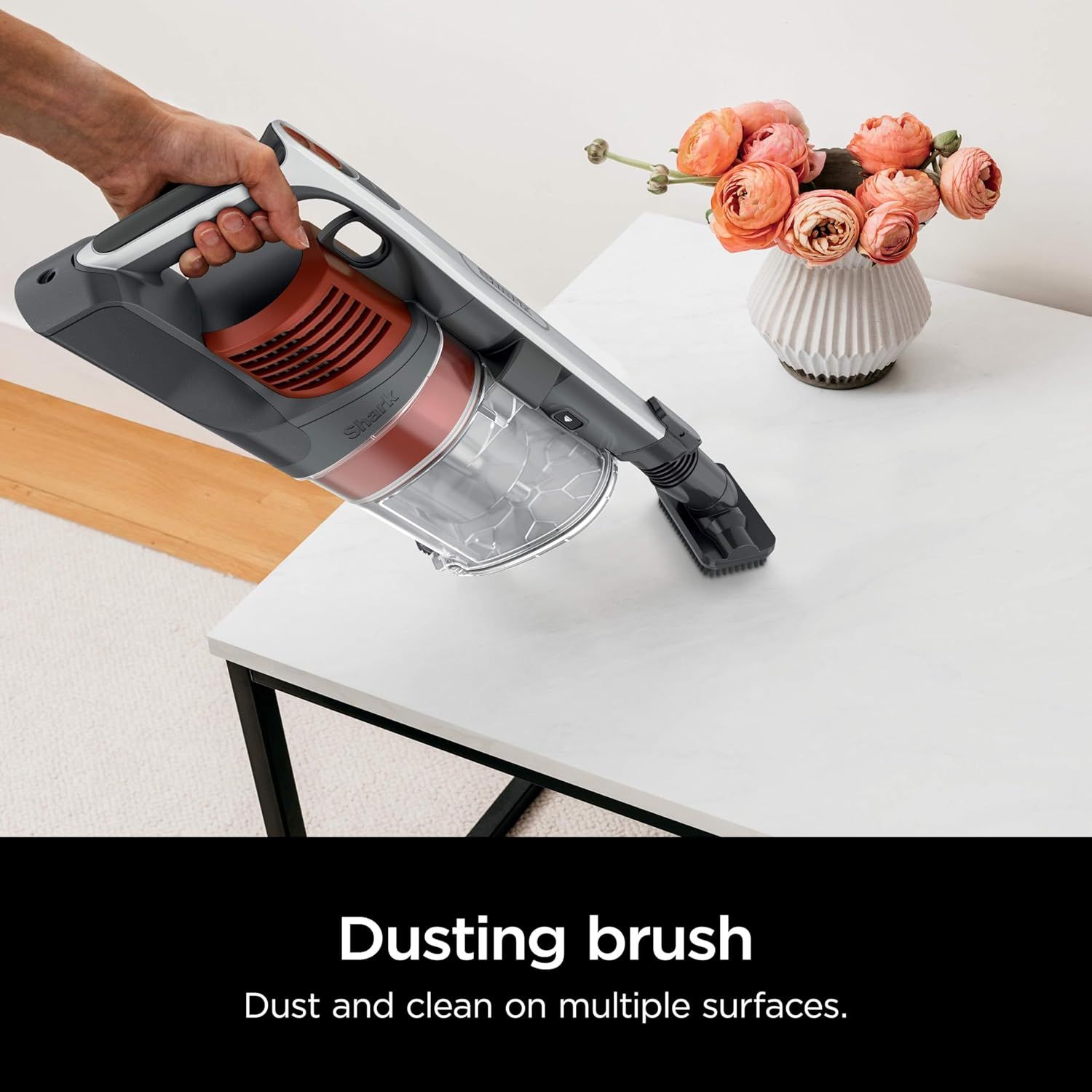 Demonstrates the dusting brush attachment in use to show shoppers that the vacuum can effectively clean multiple surfaces including furniture and delicate…