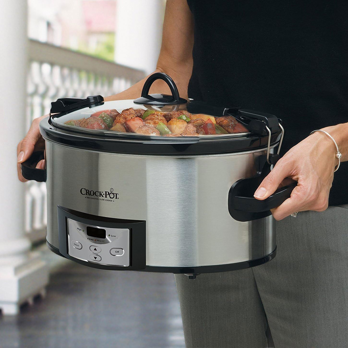 Demonstrates the product's portability and ease of carrying with secure handles, showing it in a real-world kitchen context to help shoppers visualize using…