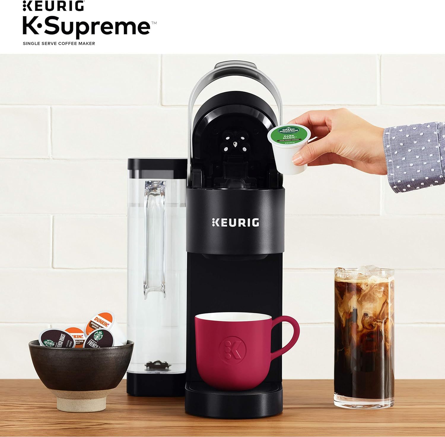 Demonstrates how simple it is to use the Keurig K-Supreme by showing a hand inserting a K-Cup pod into the machine, reassuring shoppers about ease of use. Highlights the convenience and simplicity…