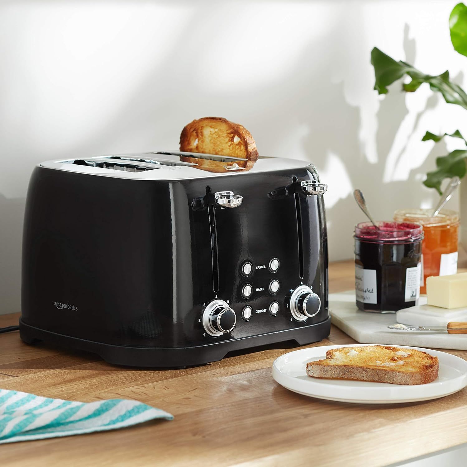 Shows the toaster in a real-world breakfast context to help shoppers visualize the product in their own home and daily routine.