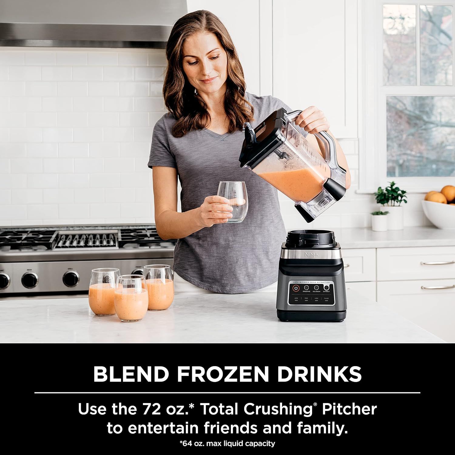 Demonstrates a specific use case for the blender—making frozen drinks to entertain friends and family—showing the product in action within a real kitchen…