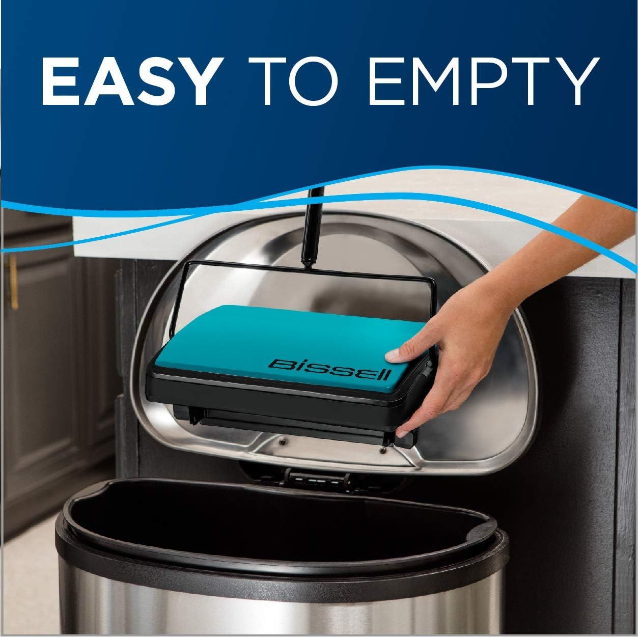 Demonstrates the convenience of emptying the vacuum's dustbin by showing a hand easily removing the dirt collection unit over a trash can, reassuring shoppers…