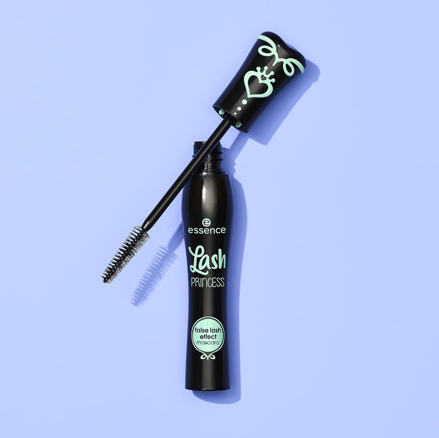 Shows the mascara product with its applicator wand extended to give shoppers a clear view of the brush design and product packaging in a clean, catalog-style…