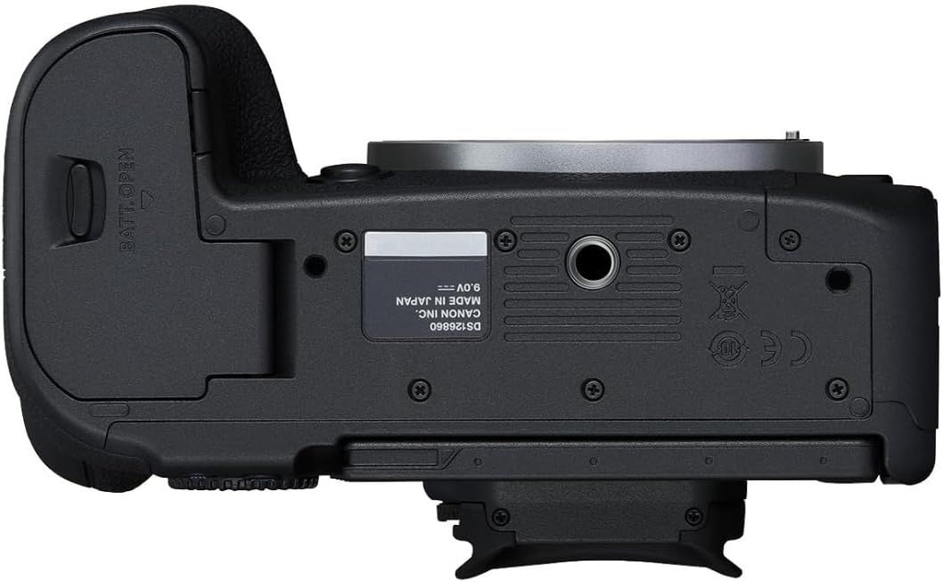 Provides a clean catalog-style view of the camera's bottom surface, showing the physical design, battery compartment, tripod mount, and regulatory markings…