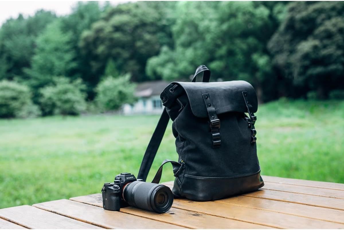 Demonstrates the product in a real-world outdoor setting to help shoppers visualize using the backpack for photography, travel, or outdoor adventures.