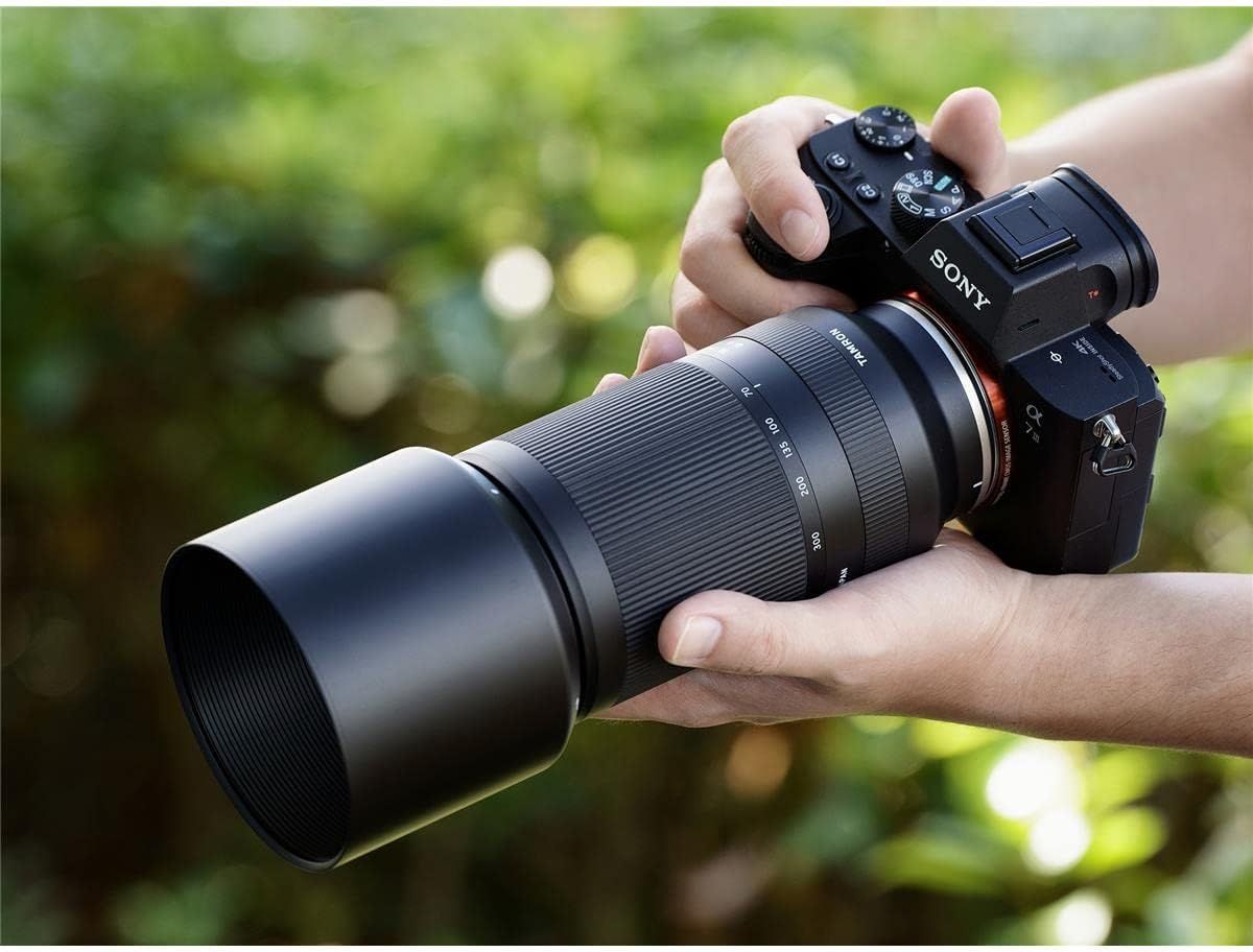 Demonstrates the product in a real-world outdoor photography context to help shoppers visualize themselves using the camera and lens system.