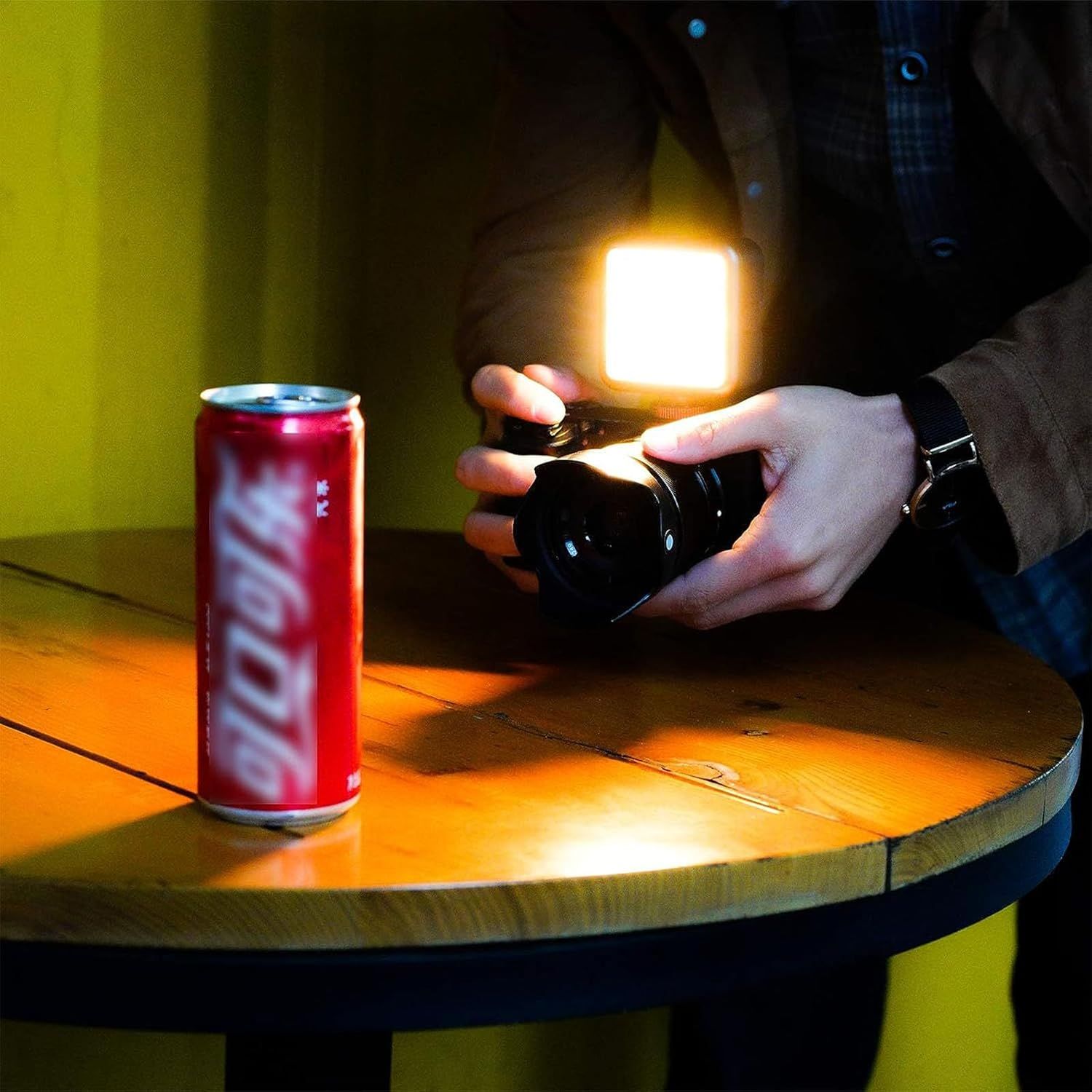 Demonstrates the small, portable size of the light by comparing it to a familiar reference object (soda can), reassuring shoppers that it's compact and easy…