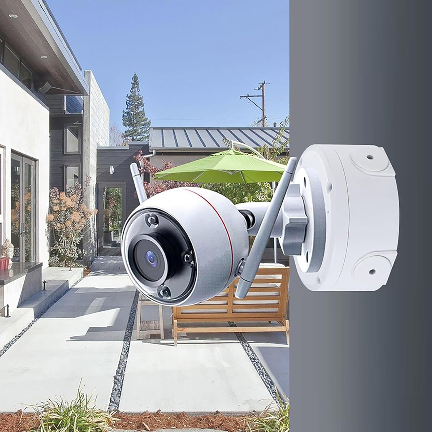 Demonstrates the product in a real-world outdoor residential setting to help shoppers visualize how the security camera would look and function in their own home environment.