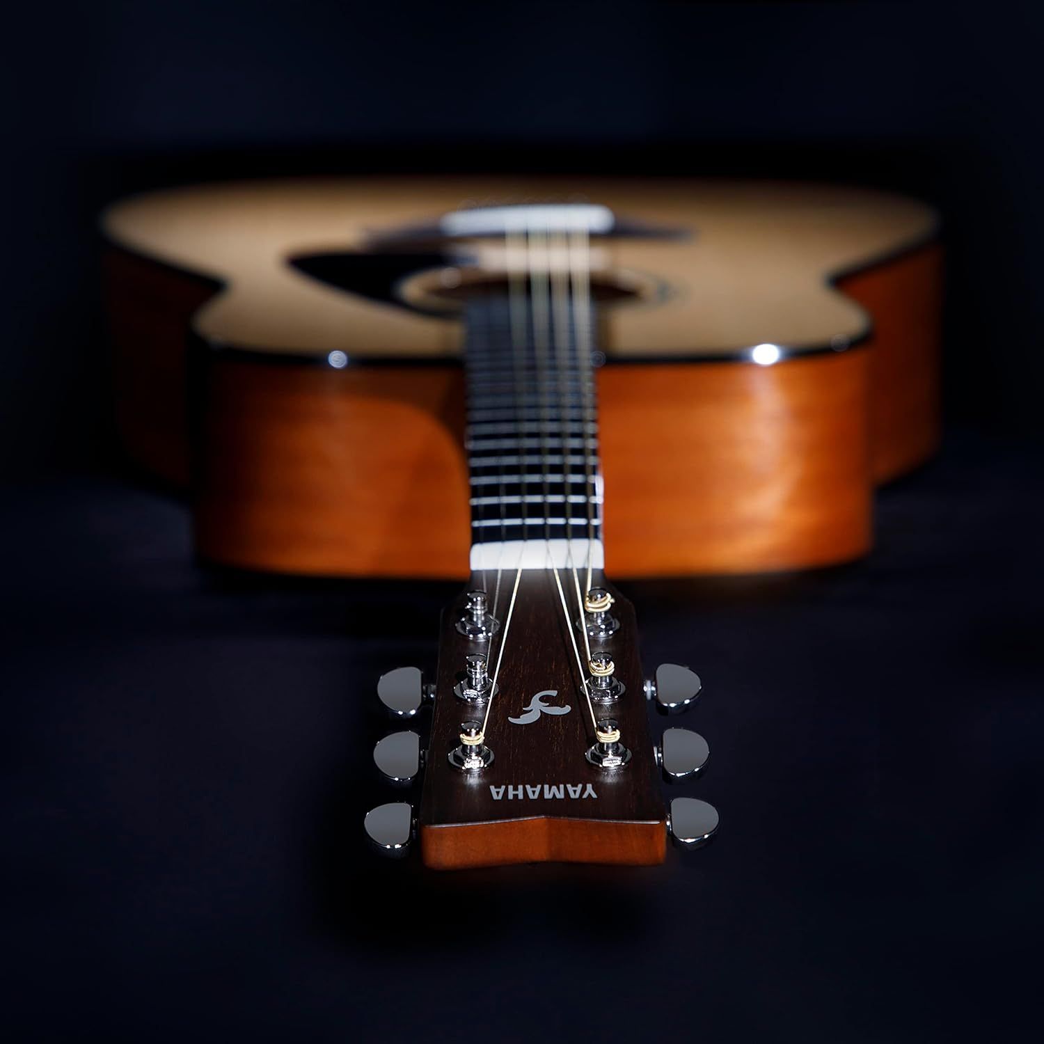 Showcases the guitar in an artistic, professional lifestyle setting to convey quality and craftsmanship, appealing to musicians and guitar enthusiasts.