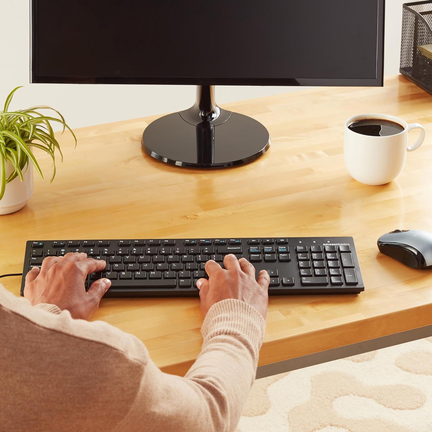 Demonstrates the product in a real-world office setting to help shoppers visualize how the keyboard and mouse would fit into their daily workspace.