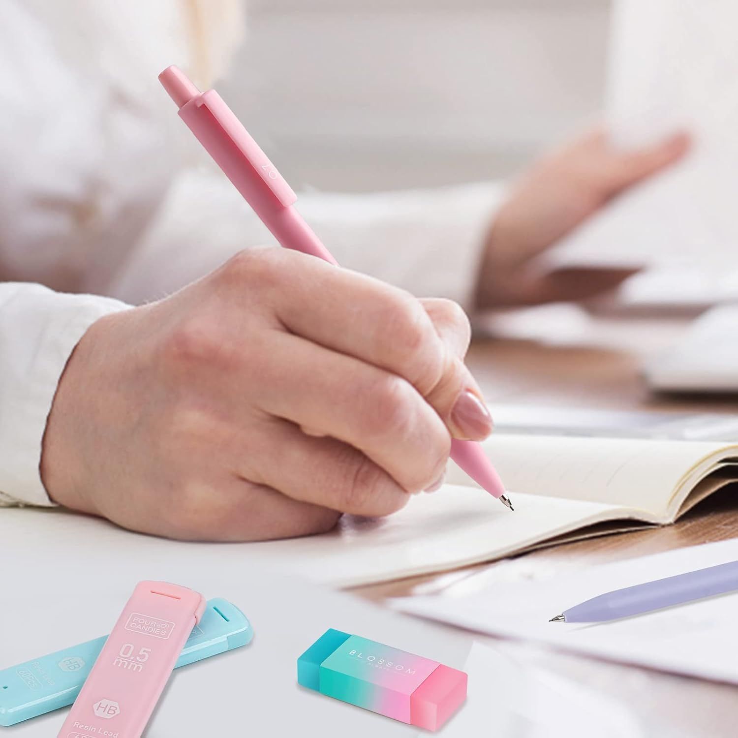 Shows the product being used in a natural, everyday study or writing environment to help shoppers visualize the pen in their own daily routine.