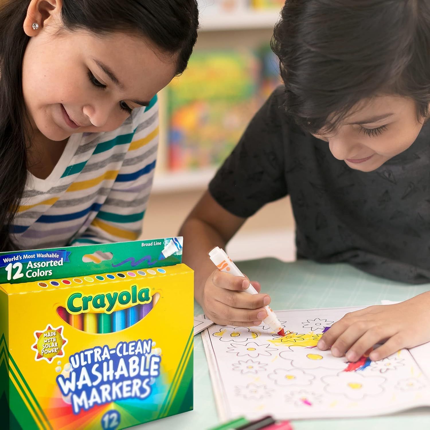 Shows the product being used in a natural, relatable setting to help shoppers visualize how the markers fit into everyday family activities and creative play.