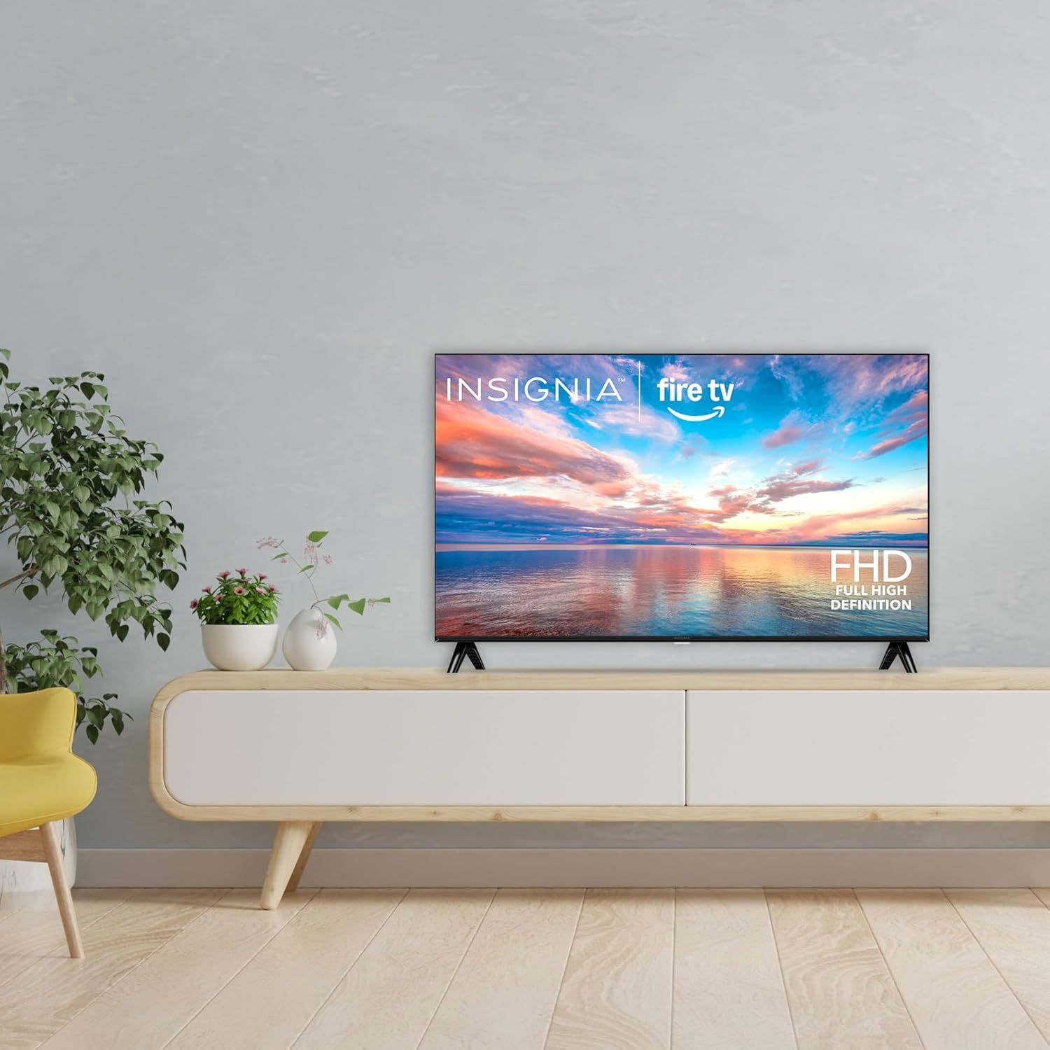 Shows the TV in a realistic home environment to help shoppers visualize how the product will look and fit in their own living space.