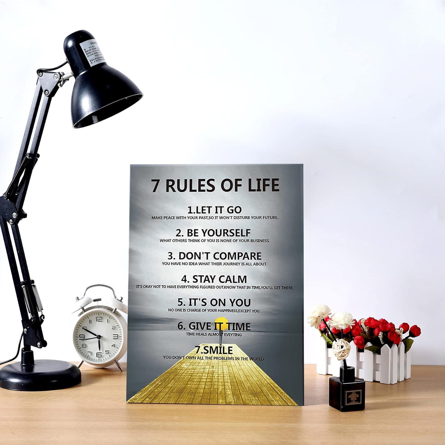 Shows the product in a real-world home or office setting to help shoppers visualize how the motivational poster would look displayed on their desk or workspace.