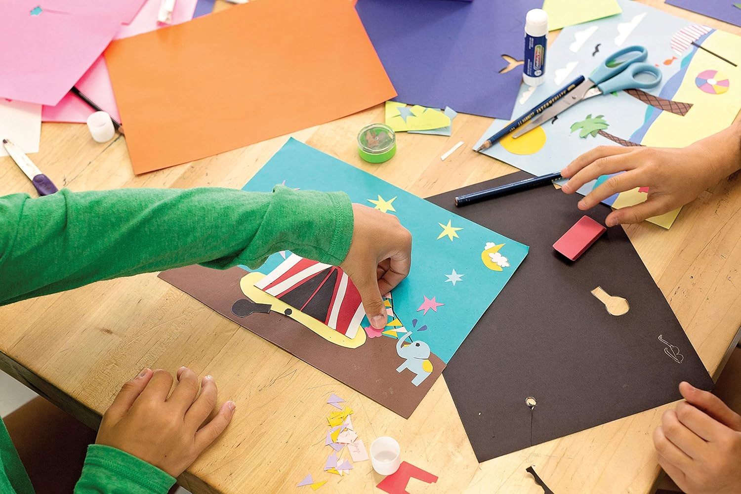 Demonstrates the product in use during a hands-on arts and crafts activity, showing shoppers how children can use the materials for creative projects and reassuring parents of its suitability for…