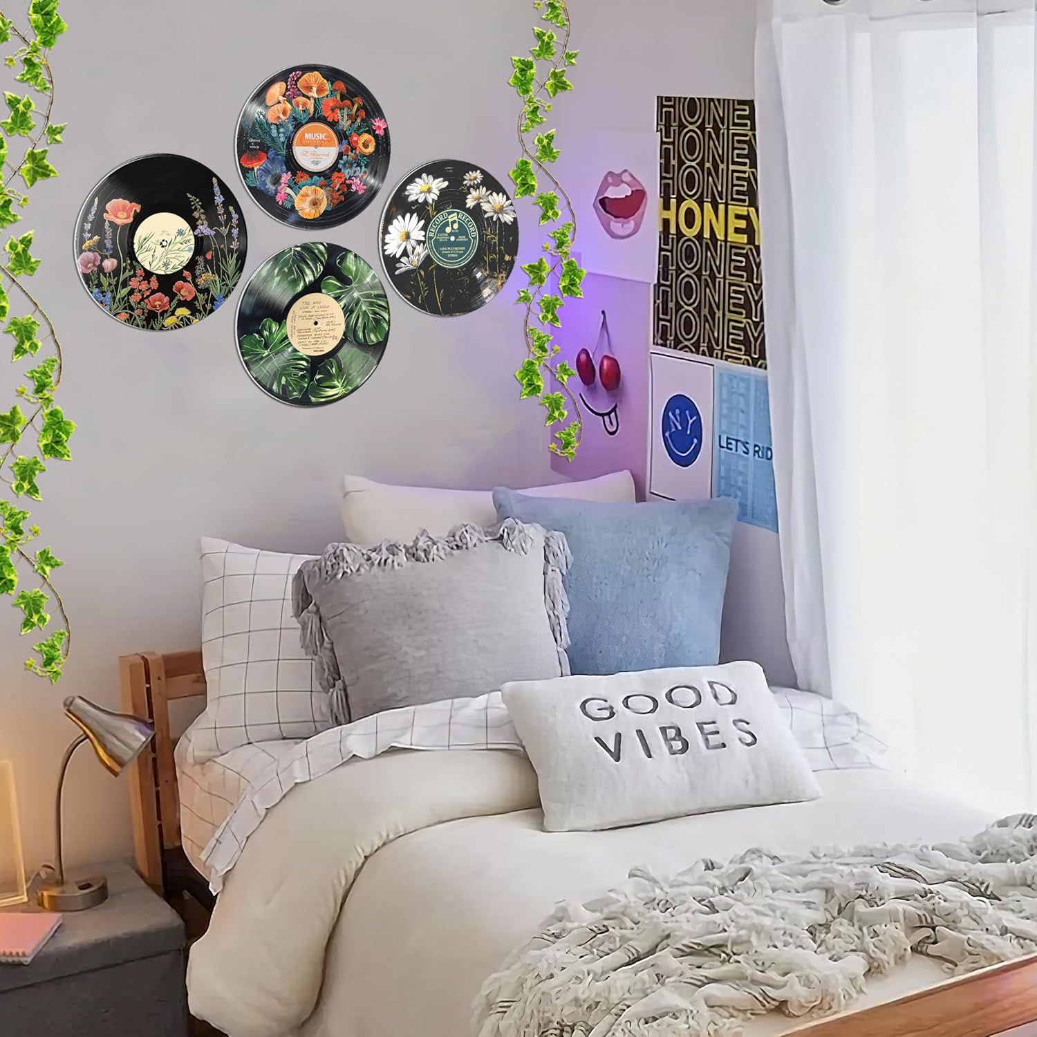 Demonstrates how the product (decorative vinyl record wall art) looks when styled in a real bedroom setting, helping shoppers visualize the product in their…