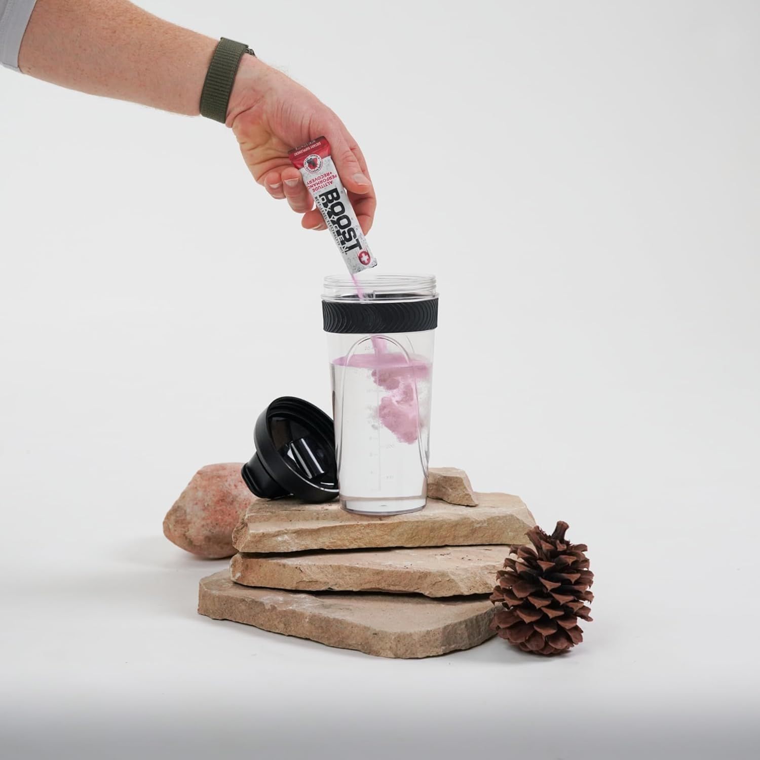 Demonstrates how to use the product by showing the simple process of adding the powder packet to water in the shaker bottle, reassuring shoppers that…