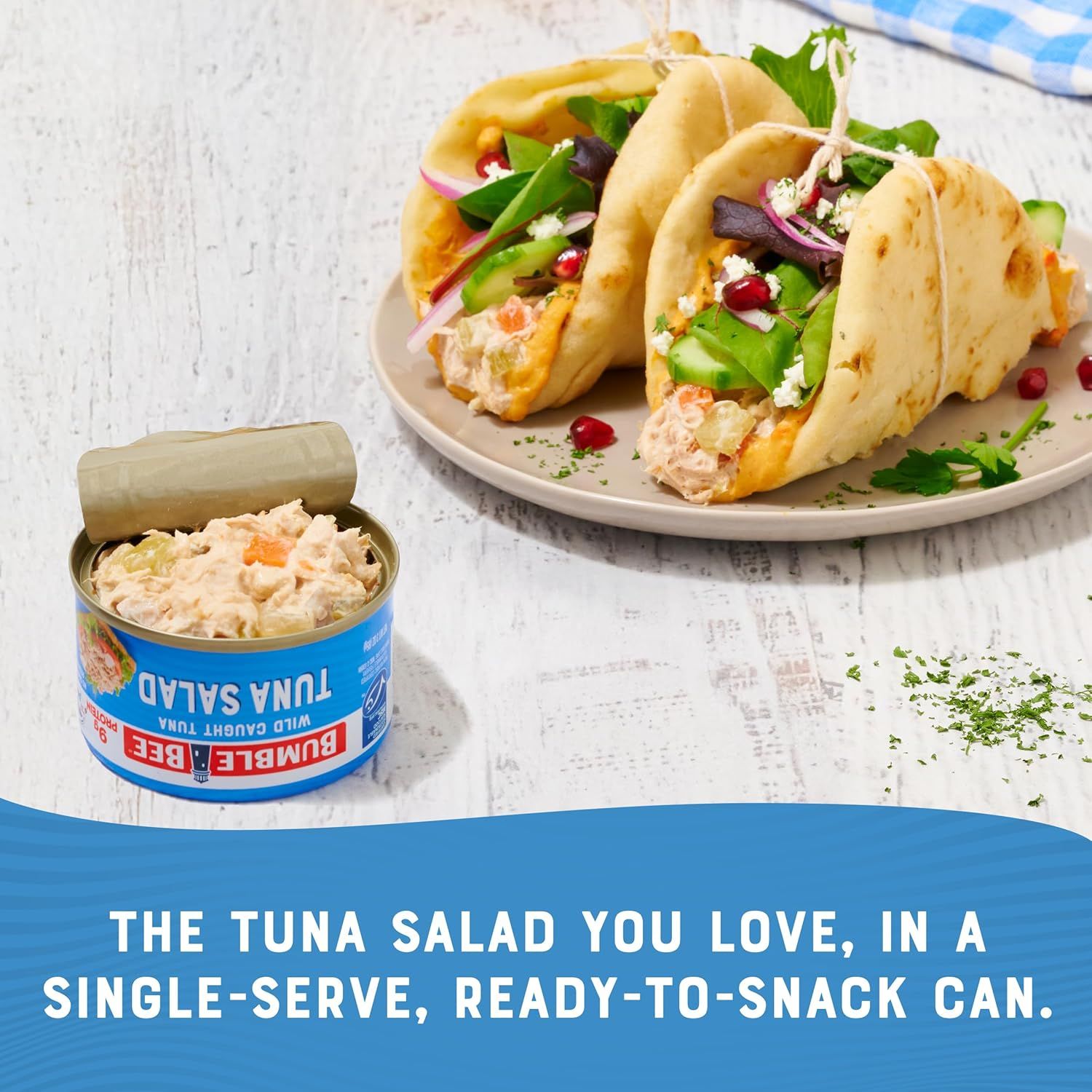 Communicates that the tuna salad comes in a convenient single-serve can format that's ready to eat, emphasizing ease of use and portability for quick meals or snacks.