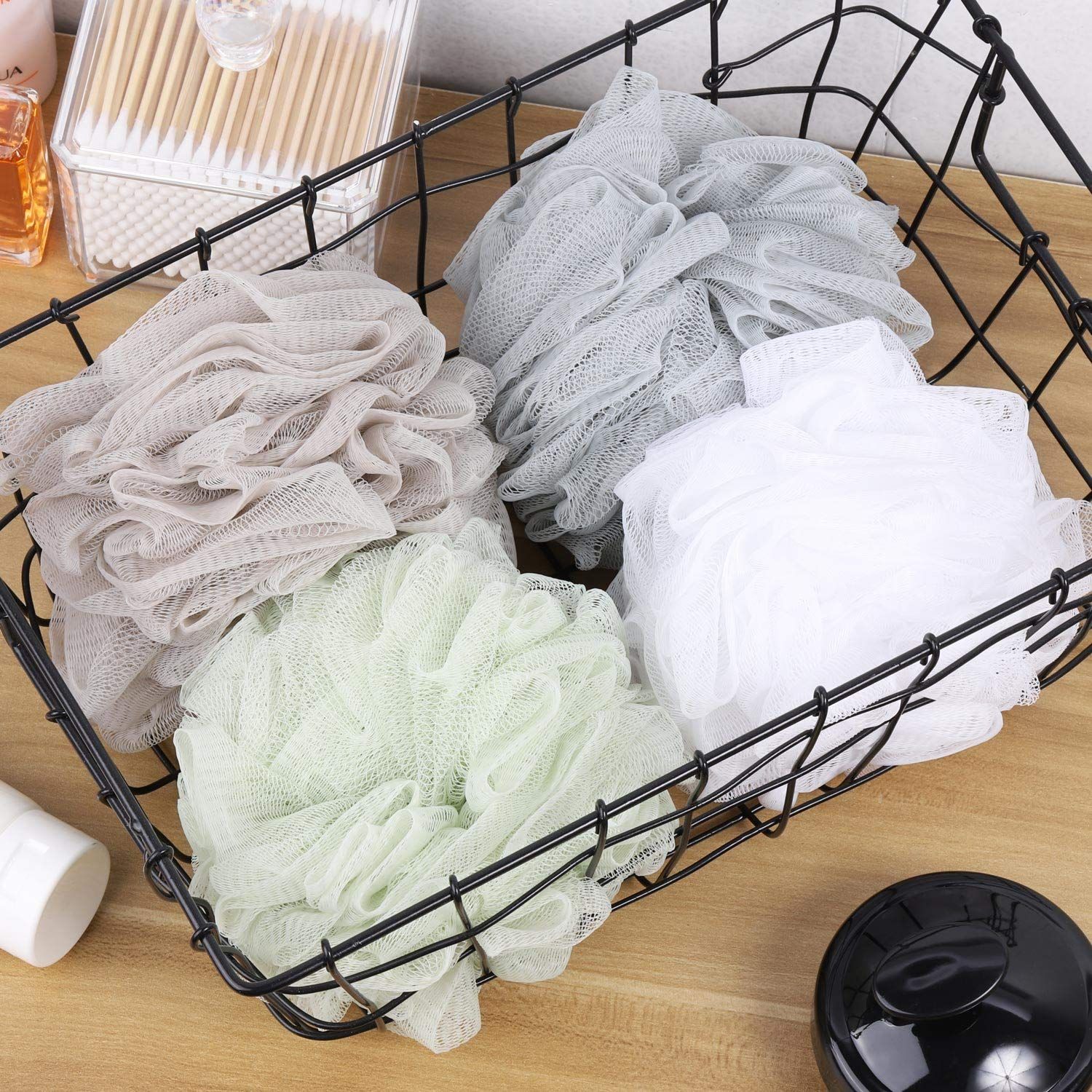Shows the customer all the color options included in the bath loofah set, demonstrating variety and value in the purchase.