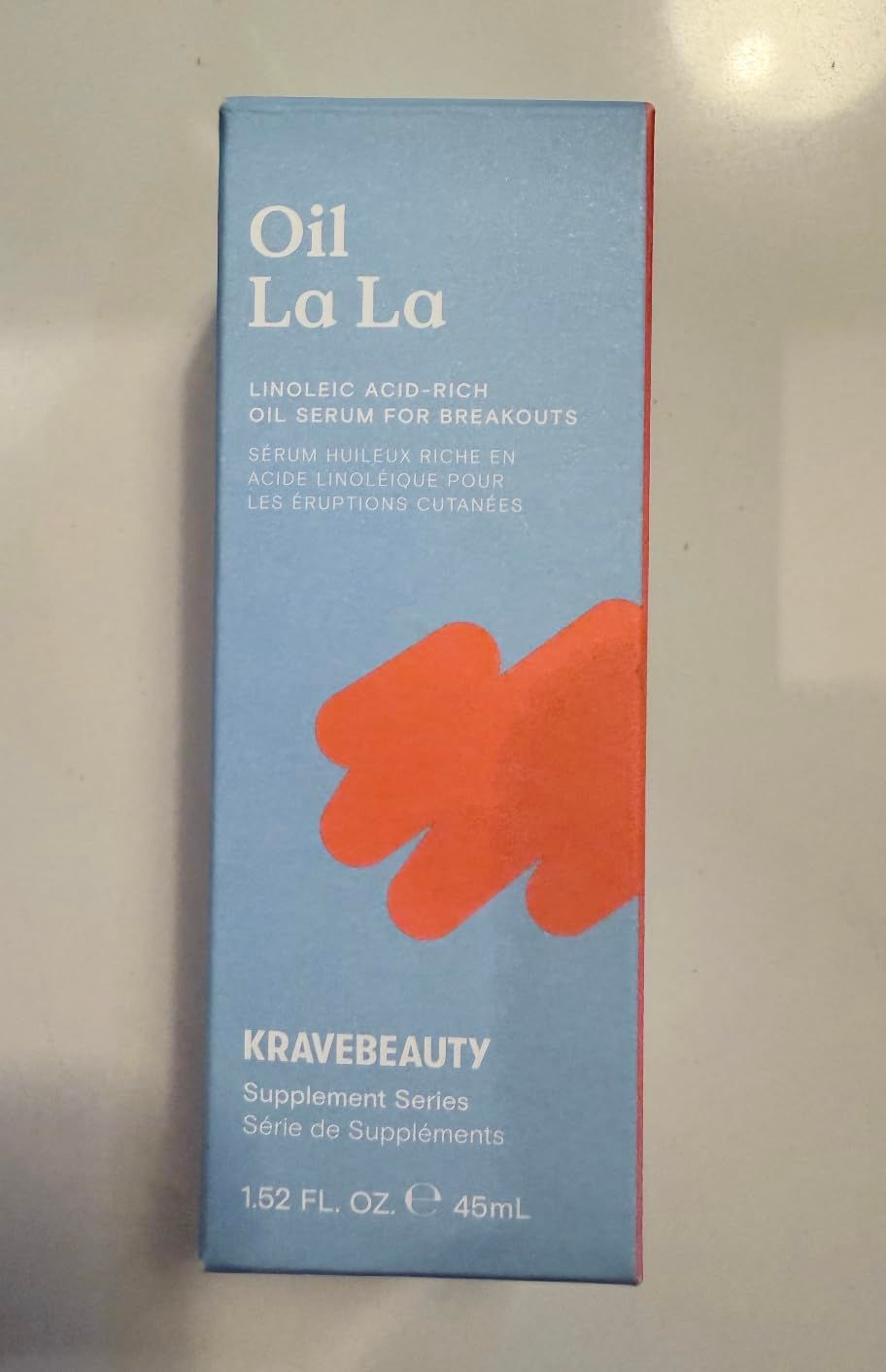 Displays the product packaging clearly on a neutral background to show shoppers what they will receive, focusing on the brand name, product type, and key ingredient (linoleic acid-rich oil serum for…