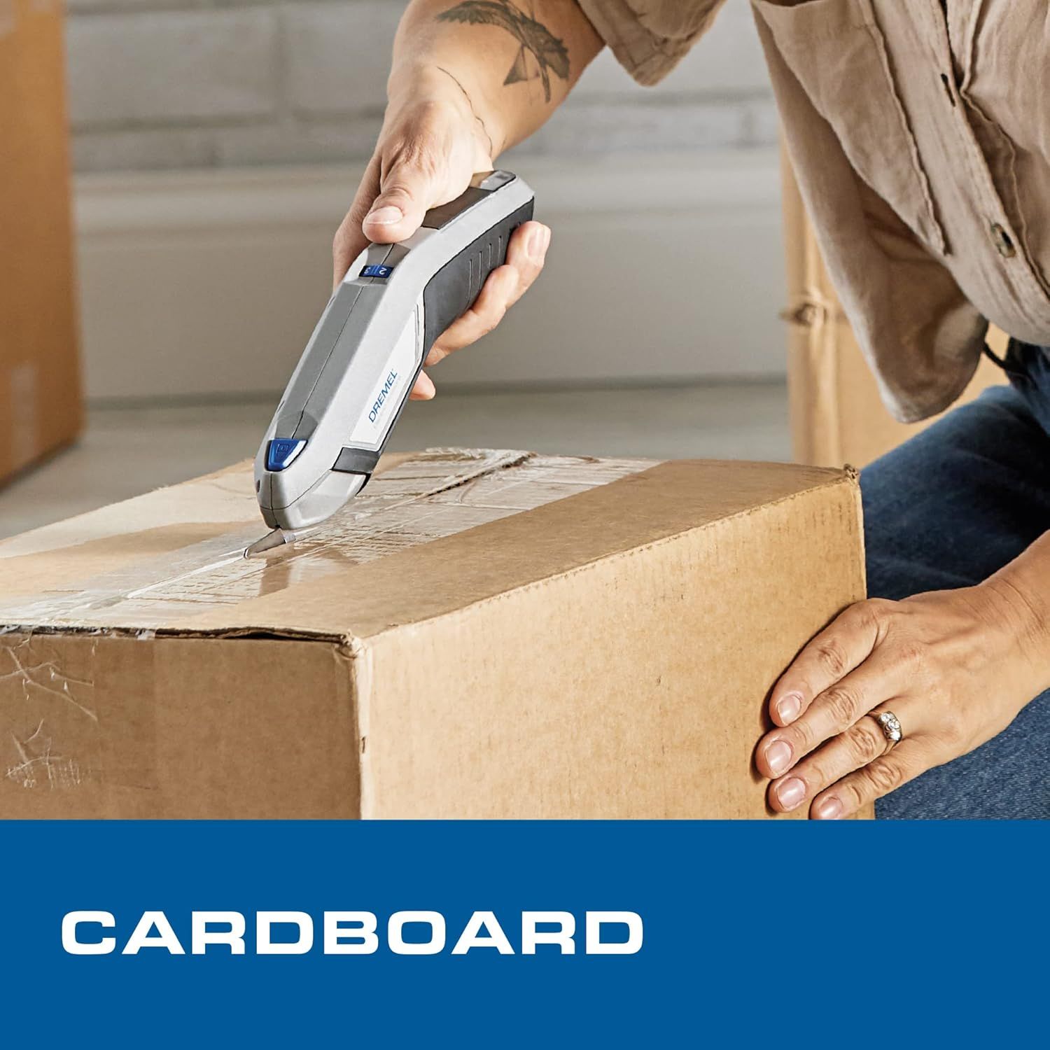 Demonstrates the product's ability to cut through cardboard, showing a practical use case for the utility knife in a real-world setting.