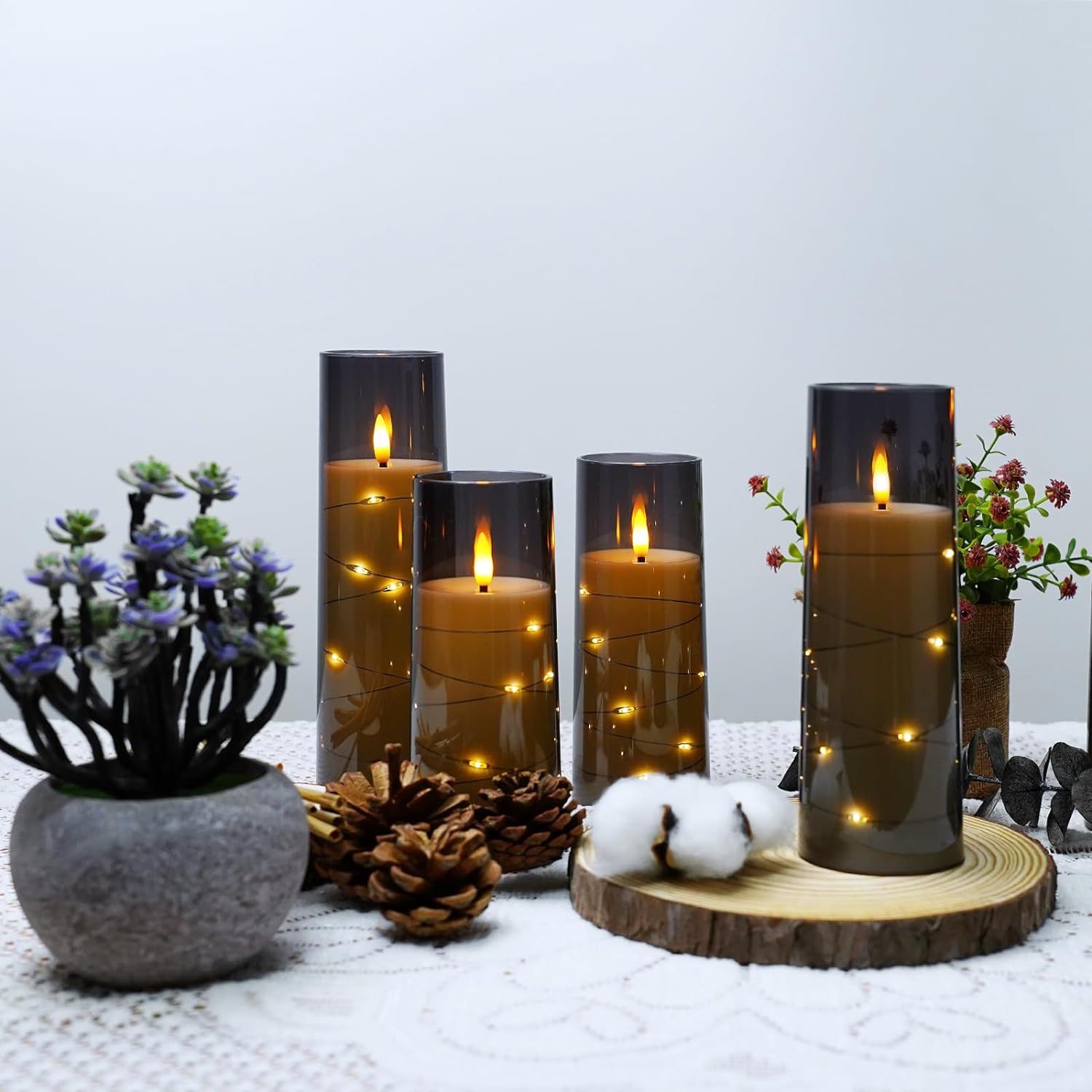 Showcases the candles in a styled home setting to help shoppers visualize how the product creates ambiance and fits into their living space.