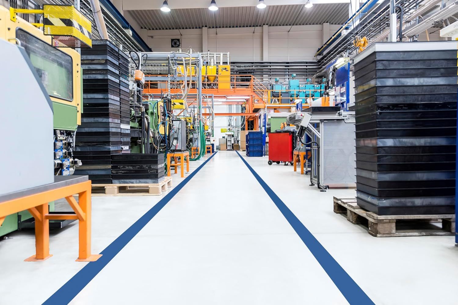 Shows the product in a real-world industrial/manufacturing setting to demonstrate its professional application and scale of operations.