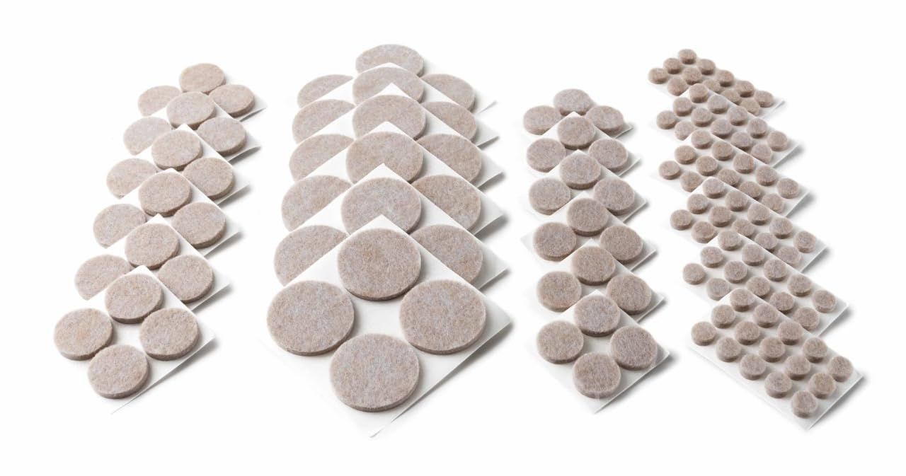 Shows the variety of felt pad sizes and shapes included in the package, helping shoppers understand they'll receive a complete assortment for different furniture and surface protection needs.