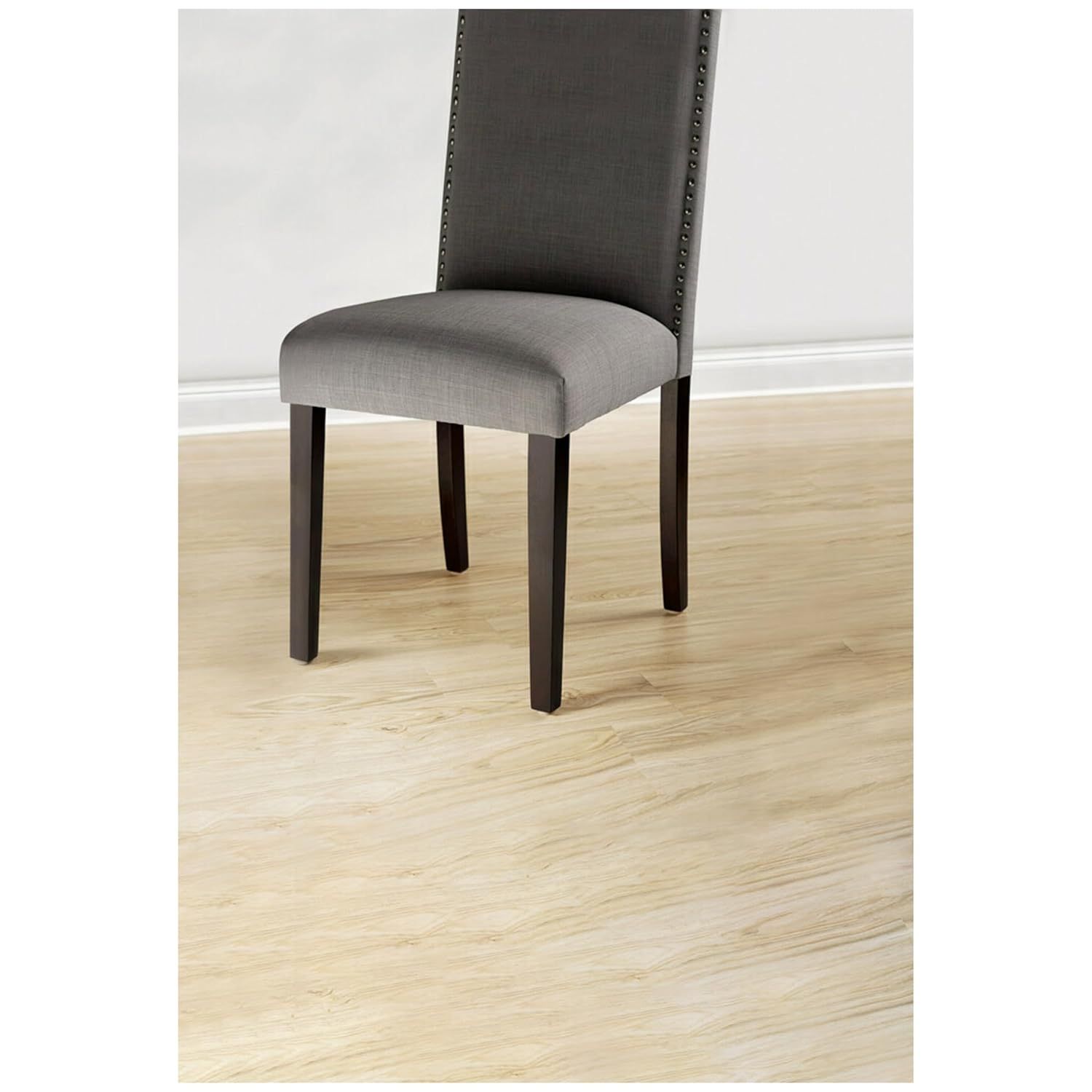Shows the product in a real-world dining room environment to help shoppers visualize how the chair will look in their own home.