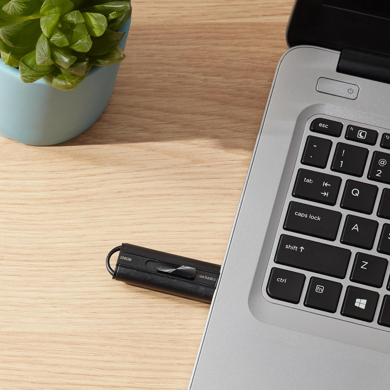 Shows the USB flash drive in a real-world office setting to help shoppers visualize how the product fits into their daily work routine.