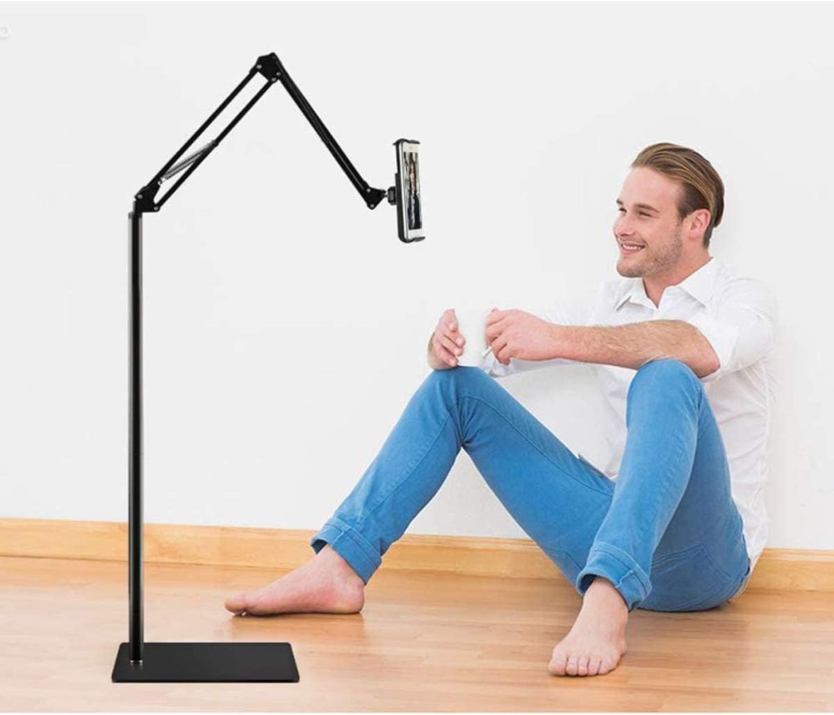 Demonstrates the product in a real-world home setting to show how the adjustable phone/tablet stand enables comfortable, hands-free viewing from various positions.