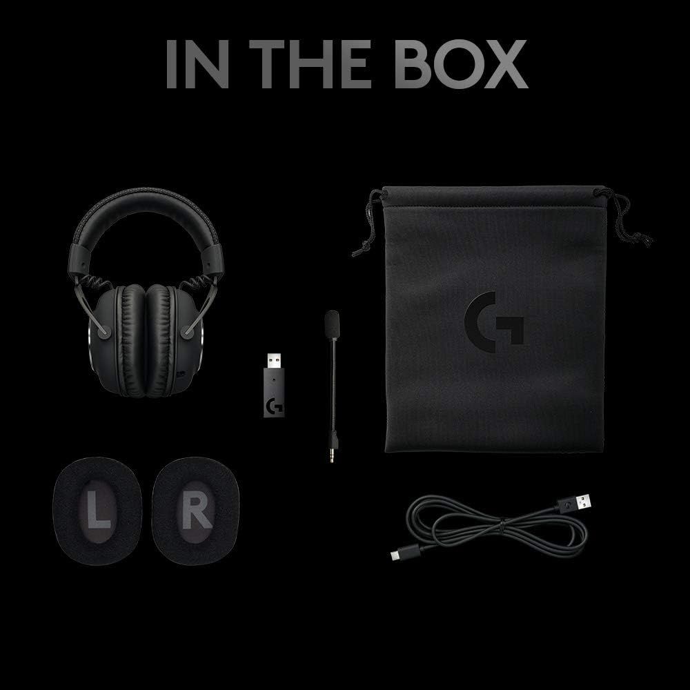 Shows everything included in the box: headphones, USB wireless adapter, microphone attachment, carrying pouch with logo, replacement ear pads (L/R), and charging cable. Reassures shoppers they're…