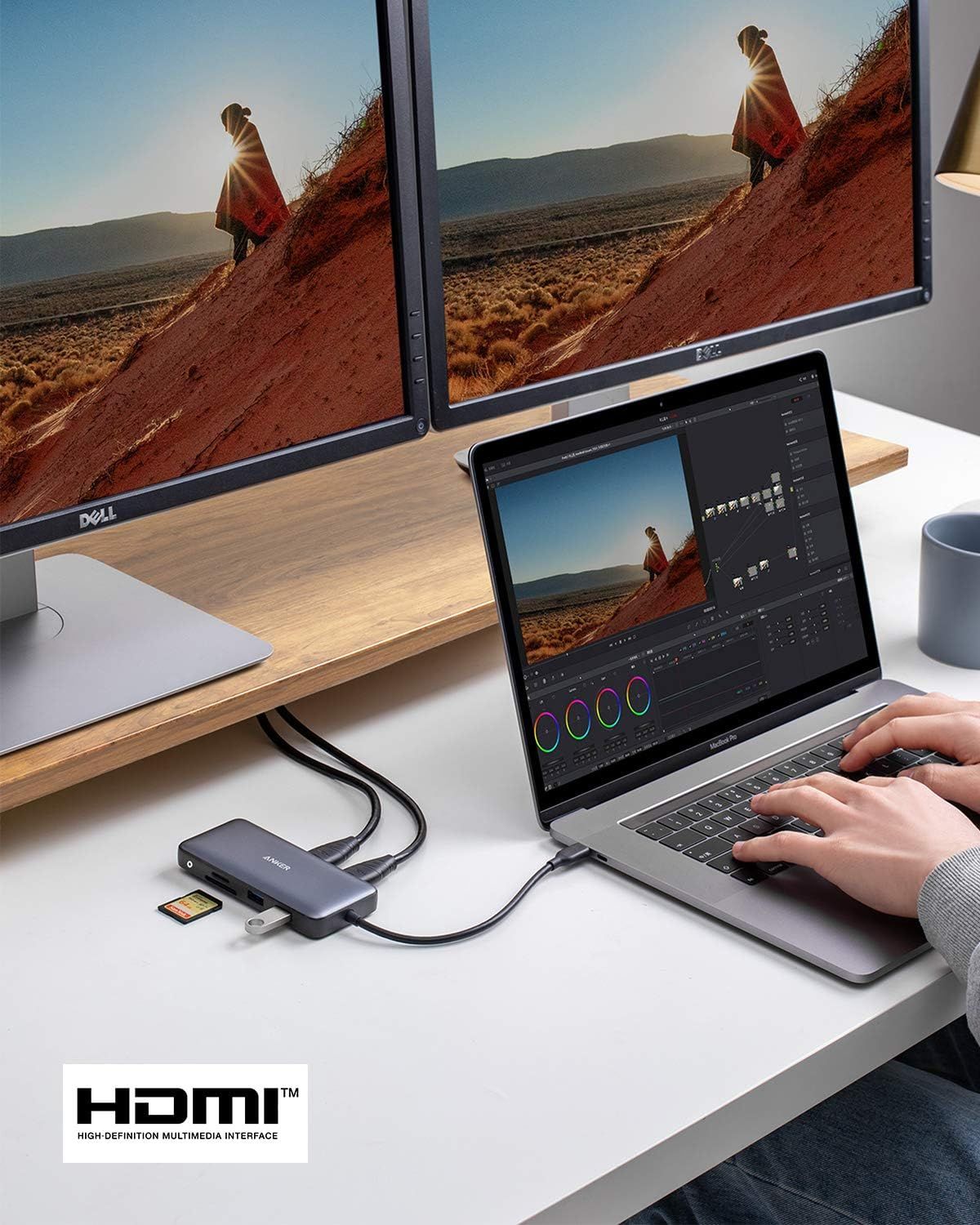 Demonstrates the USB hub's ability to connect a laptop to multiple external monitors and peripherals, showing its versatility for professional creative workflows like video editing.