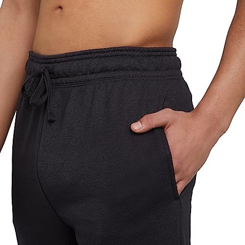 Highlights the presence of functional side pockets on the shorts, demonstrating practical storage for the shopper.