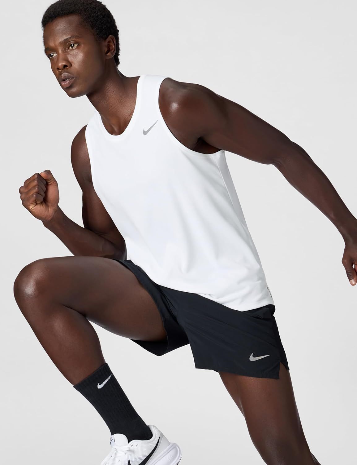 Showcases the product in an authentic athletic context to help shoppers visualize themselves using the apparel during workouts or running activities.