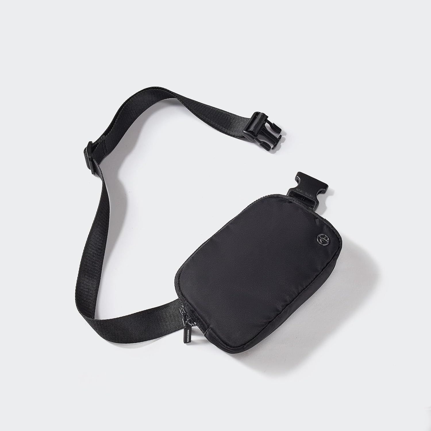 Provides a clean, catalog-style view of the black belt bag with adjustable strap and buckle closure, allowing shoppers to see the product clearly without…