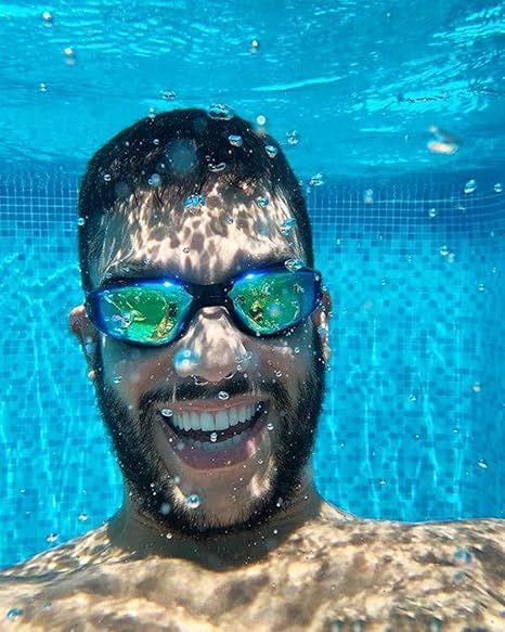 Demonstrates the product (goggles) in real-world use underwater, showing it's suitable for swimming and pool activities.