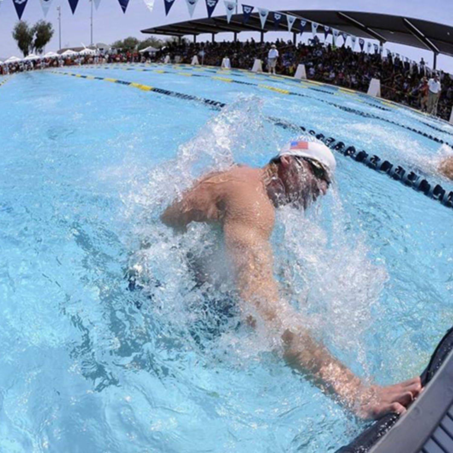 Demonstrates the product in use during a real competitive swimming event, showing the product's application in a professional athletic context to build…