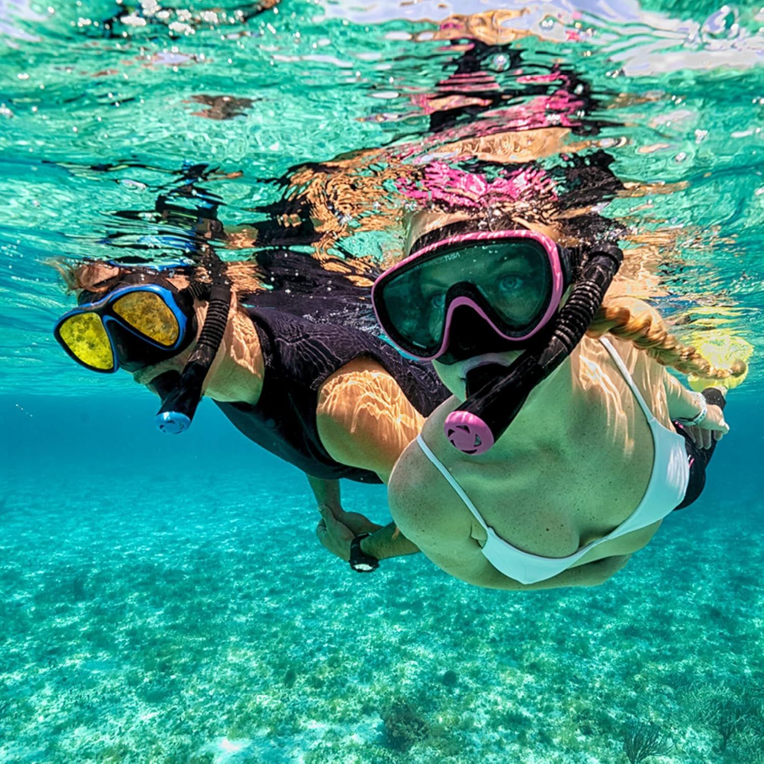 Demonstrates the product in a real-world underwater snorkeling scenario to help shoppers visualize themselves using the product during water activities.