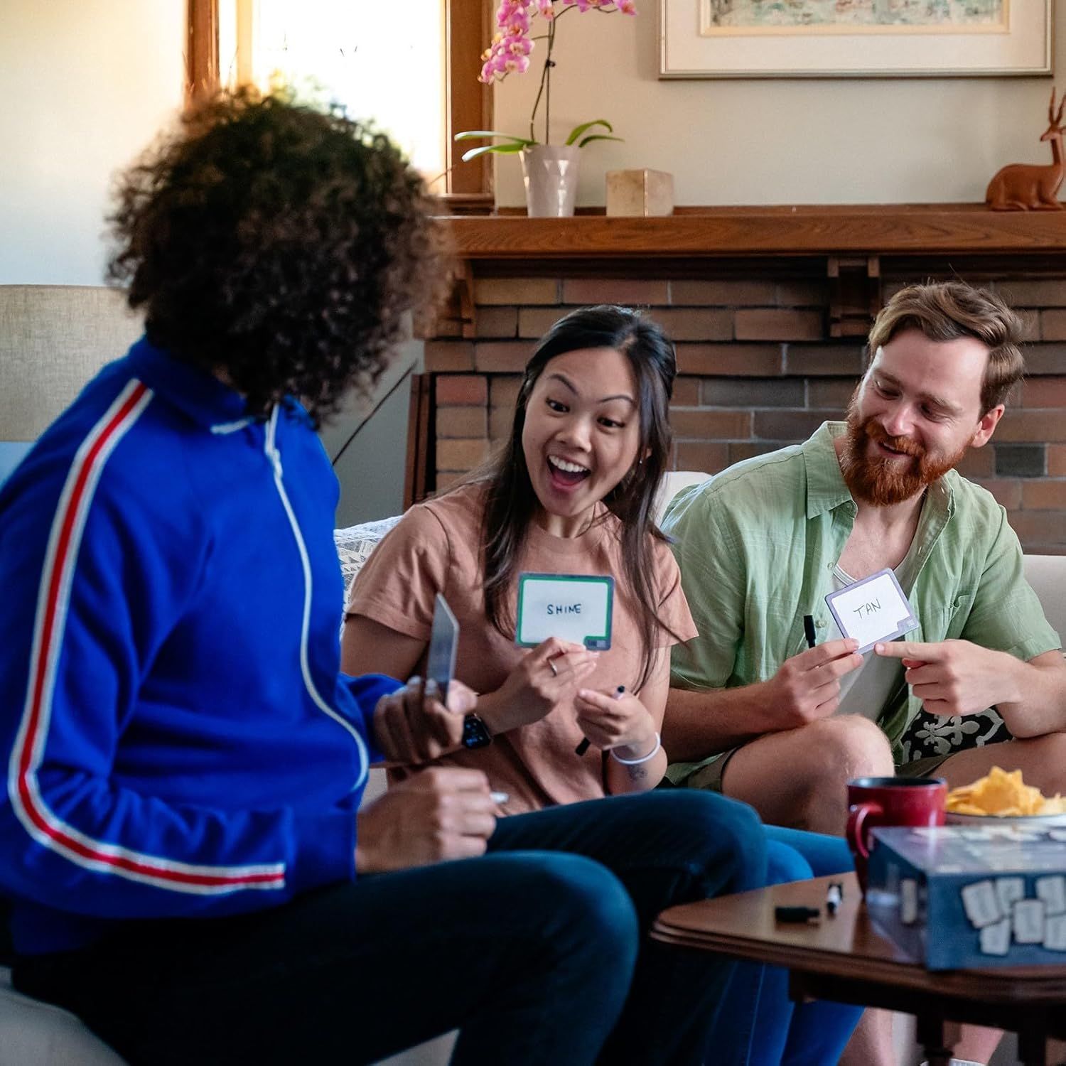 Shows the product being enjoyed in a real-world social setting to help shoppers visualize how they would use it with friends and family.