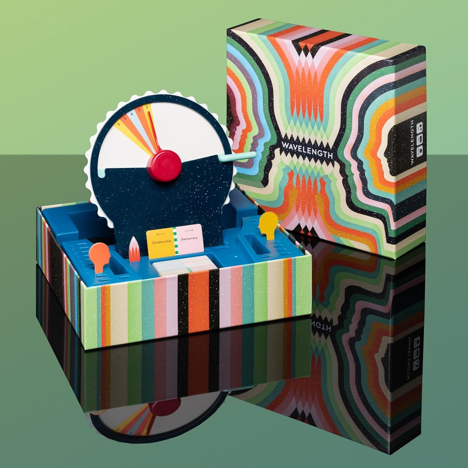 Shows all the components included in the Wavelength game box, including the dial mechanism, card holders, and game pieces, to help shoppers understand what…