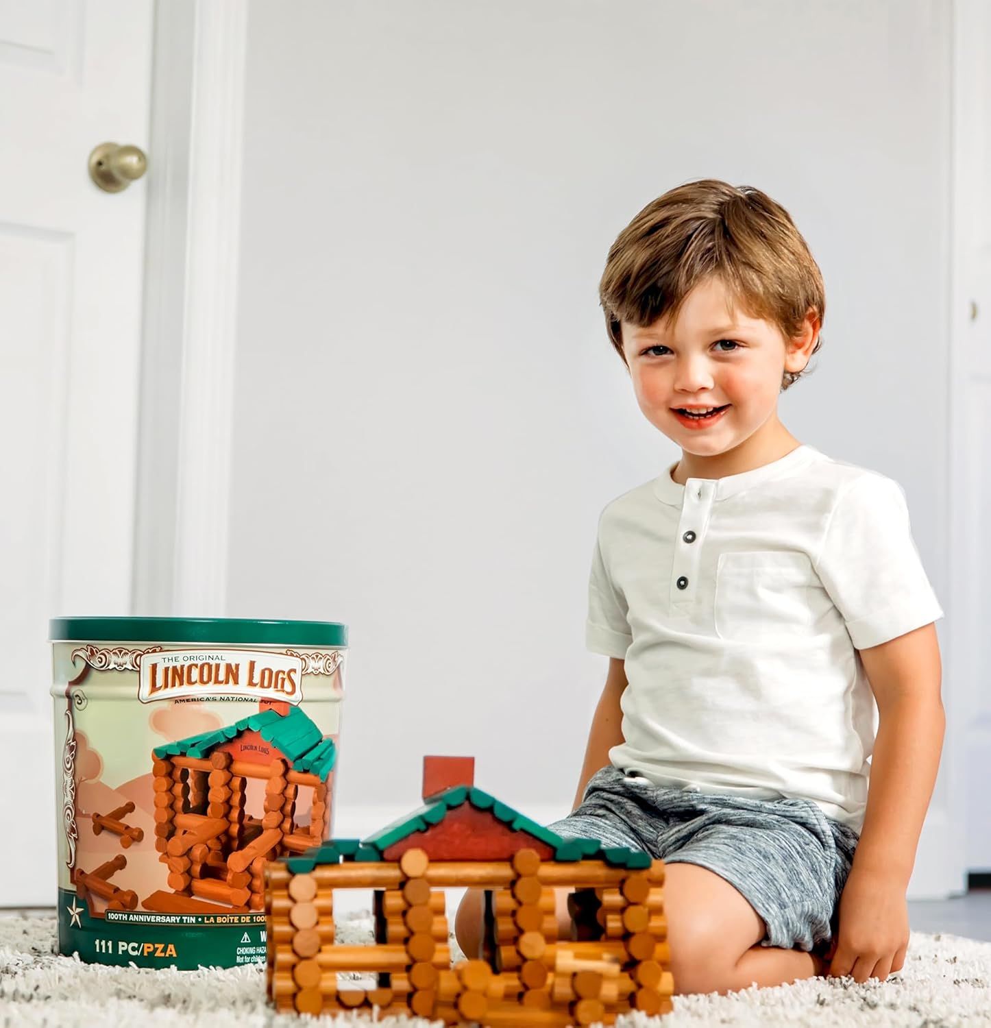 Shows the product in a real-world home setting with a happy child to demonstrate the play experience and appeal to parents looking for engaging toys for their…