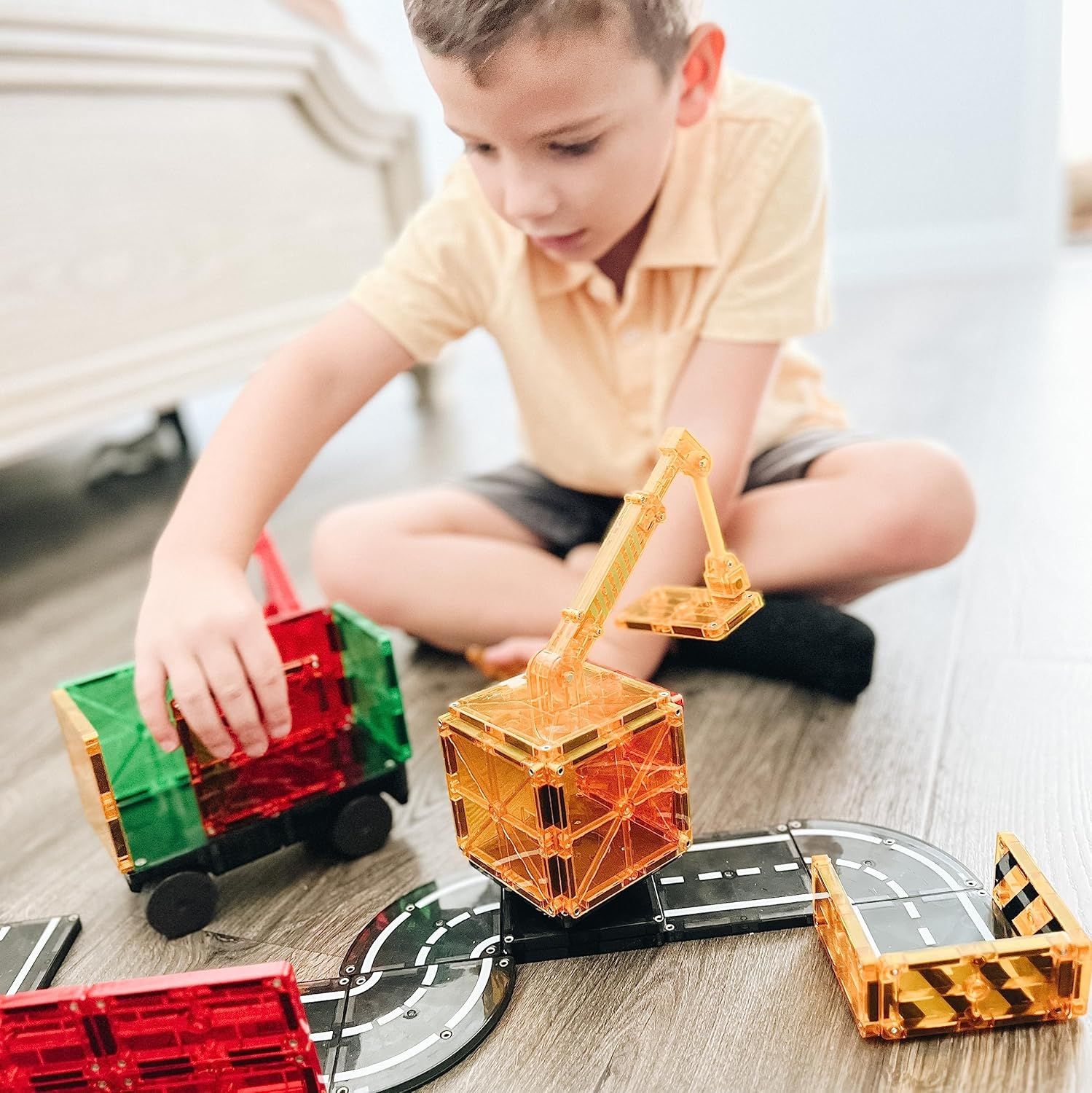 Shows the product in a real-world home setting with a child engaged in play, helping shoppers visualize how the toy is used and enjoyed by kids.