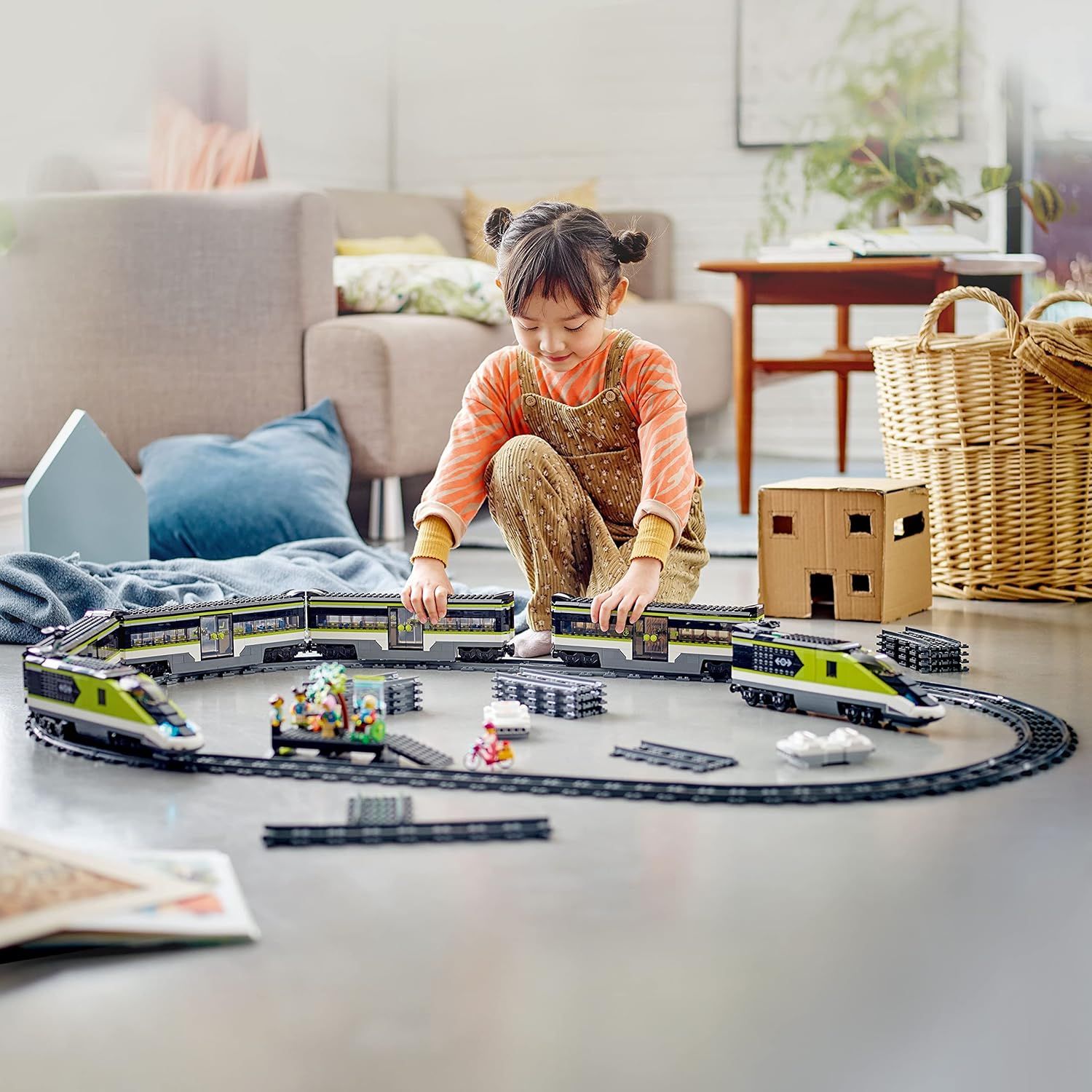 Demonstrates the product in a real-world home setting to show how children engage with and enjoy the toy train set, creating an emotional connection with…